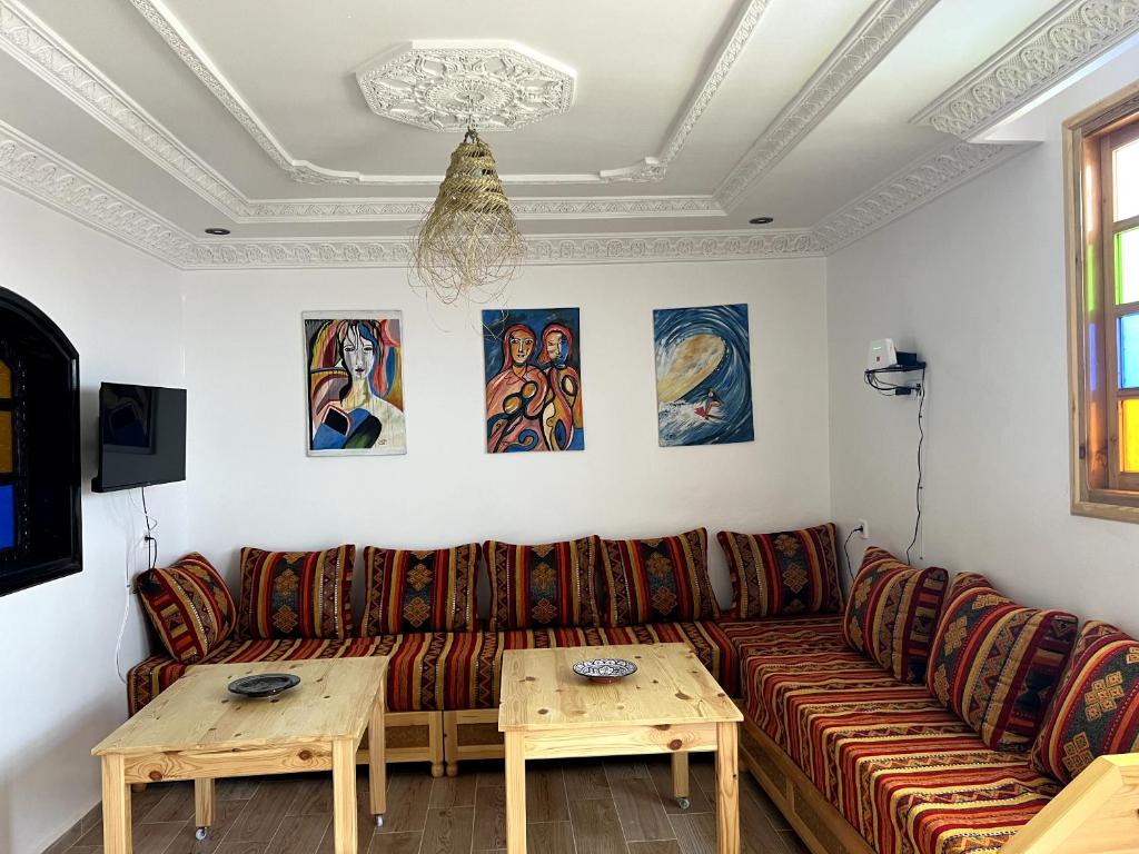 Traditional Moroccan living room with surf art